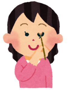 メイクをしている女性のイラスト